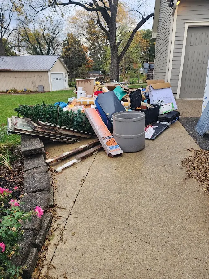 Dumpster being loaded with debris for 30 Yard Dumpster Rental in Salinas